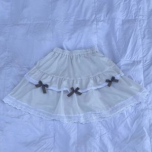 pure white skirt with checkered bows
